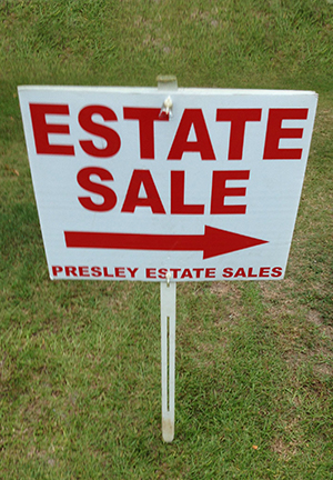 lawn sign at an estate sale